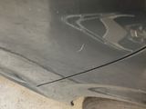 a close up of a car ' s front bumper with a star painted on it
