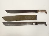 three knives are lined up on a white surface, one has a brown handle and the other has a black handle