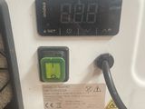 an image of a machine with a digital clock on it