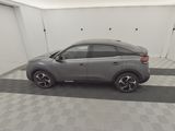 an image of a grey car in a garage