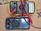 two multimeters that are sitting on a box