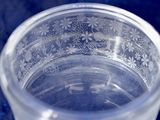 a clear glass bowl with a floral design on it
