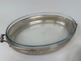 a glass tray with a handle on a table