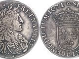 a silver coin with a crown on top of it