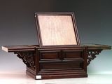 a wooden table with a mirror on top of it