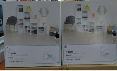 two boxes of furniture that are on the table