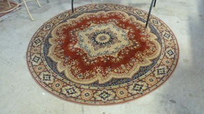 a round rug on the floor in a room