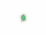 a close up of a ring with a green stone in it