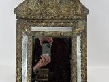 a person taking a picture of themselves in a mirror