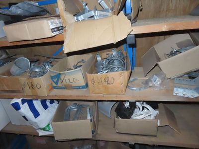many boxes of assorted items sitting on a shelf