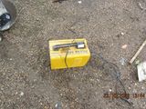 a yellow box that is sitting on the ground