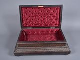 a box with a red velvet lining inside of it