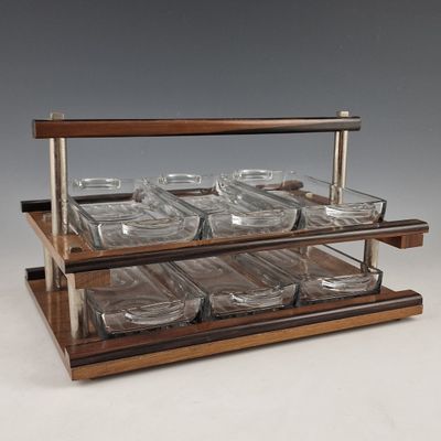 an image of a display of glass dishes on a wooden stand