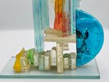 a glass sculpture of a fire hydrant and a blue object