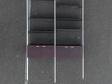 overhead view of a book shelf in a parking lot with a parking meter