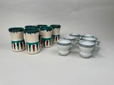 six cups and six saucers are sitting next to each other