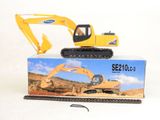 a toy excavator sitting on top of a box