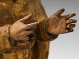 an image of a statue of a person holding their hands out