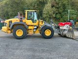 a picture of a construction vehicle parked in a parking lot
