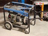 two generators that are sitting in the garage