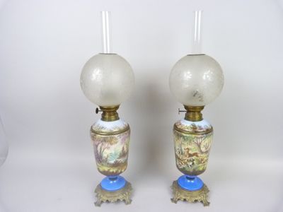 two lamps that are sitting next to each other on a table