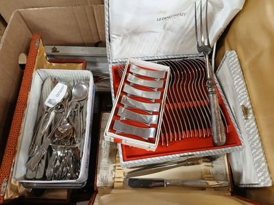 a box with a bunch of silverware inside of it