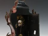 a small clock that is sitting on a table