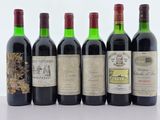 plusieurs bouteilles de vin sont alignées sur une table
