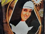 a cardboard picture of a nun with a cross on it