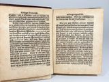 an open book with a page of text on it sitting on a table