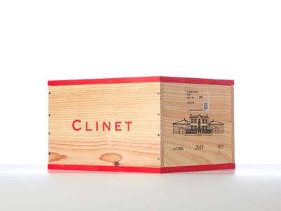 a wooden box with a red lid on a table