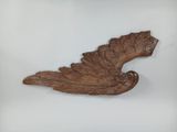an image of a wooden sculpture of a bird on a white background