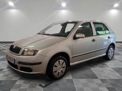 a picture of a silver car parked in a room