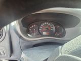 a close up of a dashboard with a speedometer in it