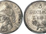 a close up of a silver coin with a woman on it