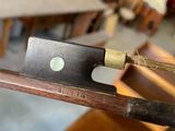a knife that is on top of a piece of wood