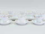 a group of cups and saucers sitting on top of each other