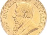 l'image d'une pièce d'or sur laquelle figure le visage d'un homme