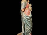 an image of a statue of a woman holding a baby