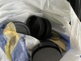 a plastic bag with a pair of headphones inside of it
