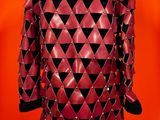 an image of a red leather jacket with black triangles on it