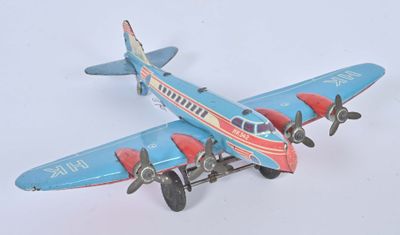 a toy airplane that is sitting on a white surface