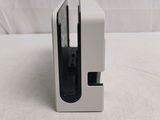 a white box with a black handle on a table