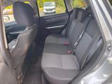 the back seats of a car are empty in a parking lot