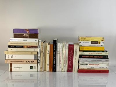 many books stacked on top of each other on a table