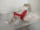 a red box with several rolls of tape on top of it