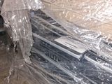 a pile of books wrapped in plastic on the floor