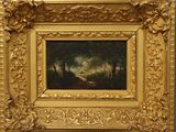 une photo d'un tableau accroché au mur, dans un cadre doré