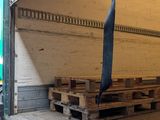 a truck that is loaded with wooden pallets