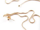 a gold necklace with a gold chain and a gold bead necklace with a gold chain and a gold bead necklace with a gold bead chain
